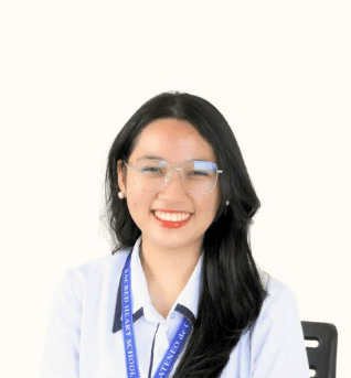 Smiling young woman with glasses and long black hair wearing a white school uniform and lanyard.