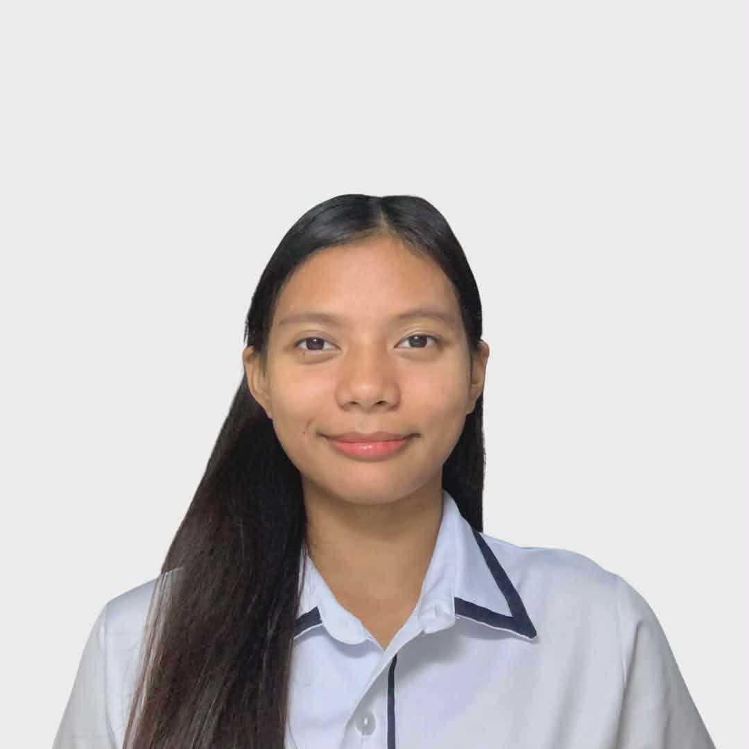 Portrait of a young woman with long dark hair wearing a white collared shirt.